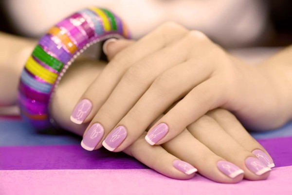 Убави жени's manicure with purple polish on the nails
