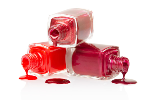Red nail polish spilled isolated on white background, clipping path included