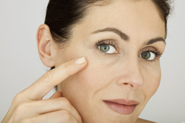 Woman touching face, portrait