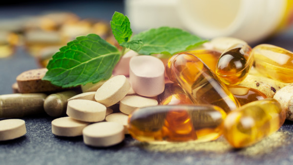 pills and multivitamins on a dark background, closeup; Shutterstock ID 253771126; PO: MC for TODAY