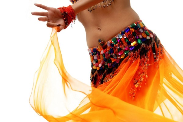 Photo of belly-dancer in traditional orange costume