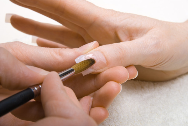 1446908415_bigstock-professional-manicurist-applyi-17823005