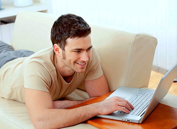 Man using laptop at home