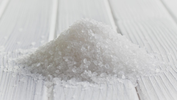 CXR55K white crystal salt on wooden table