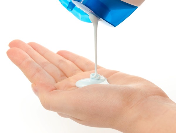 Shampoo and woman's hands